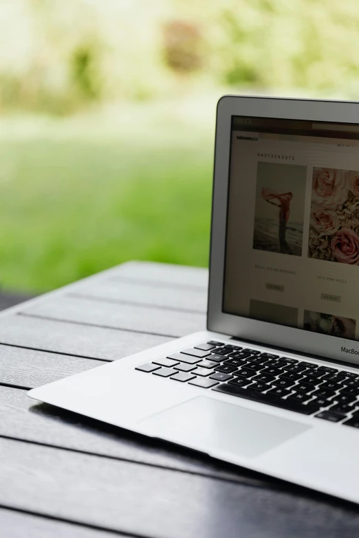 a laptop computer sitting on top of a wooden table, by Dan Content, unsplash, sitting in the garden, digital banner, profile image, thumbnail