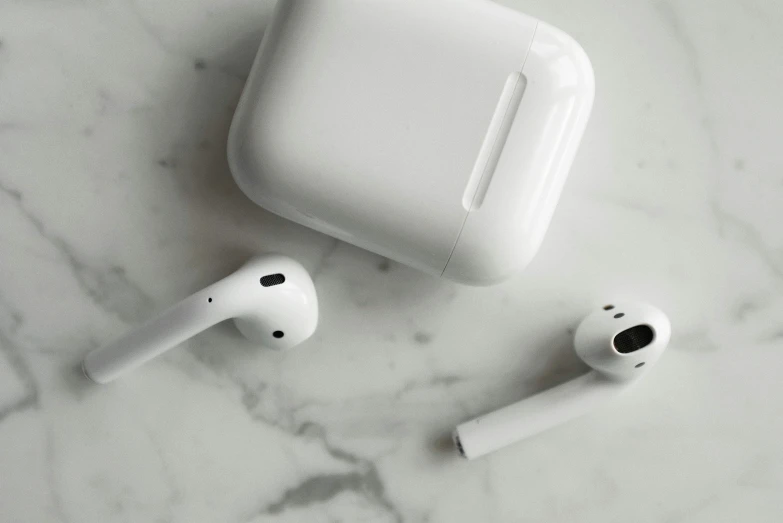 a pair of airpods sitting on top of a marble counter, by Carey Morris, trending on pexels, square, pipe, white sleeves, aircraft