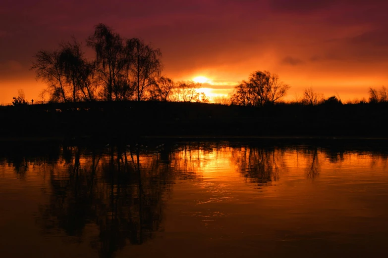 the sun is setting over a body of water, by Sebastian Spreng, pexels contest winner, romanticism, red river, fire reflection, spring evening, today\'s featured photograph 4k