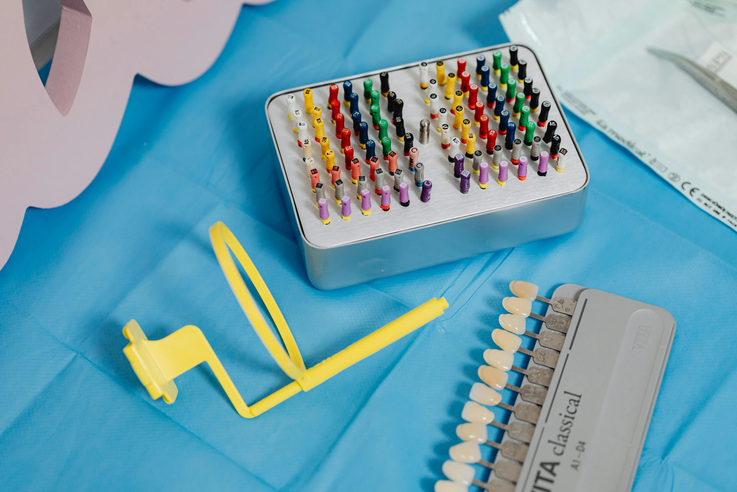 a bunch of crayon sticks sitting on top of a table, a cartoon, inspired by Damien Hirst, detailed implants, with electric arc device, 4 0 0 0 samples, pi-slices and kidmograph