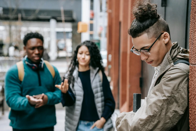 a group of people standing next to each other on a sidewalk, trending on pexels, happening, jewish young man with glasses, black teenage boy, aboriginal australian hipster, complaints