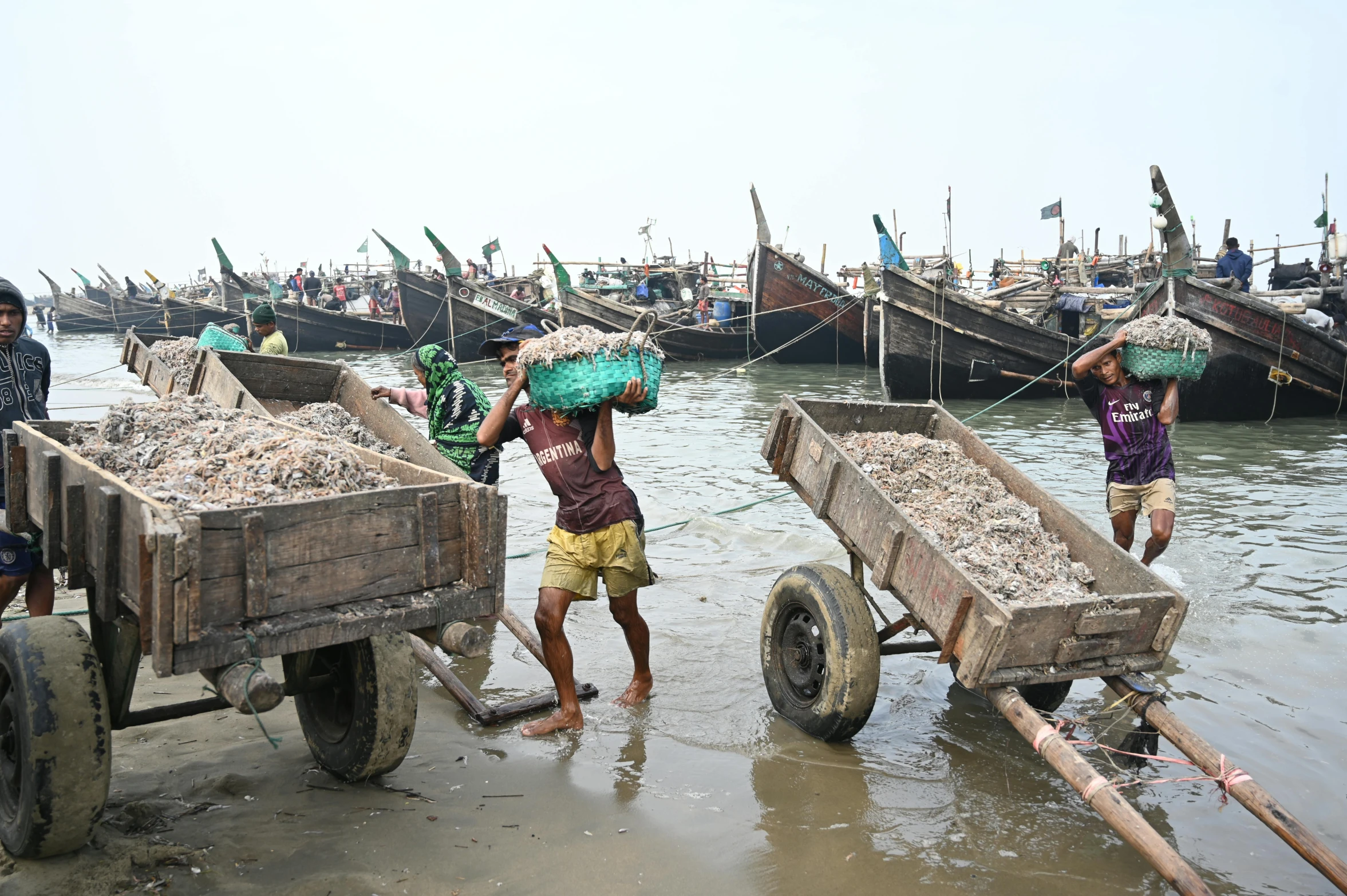 a group of people standing next to a body of water, by Benjamin Block, pexels contest winner, hurufiyya, people at work, shells, with water and boats, thumbnail