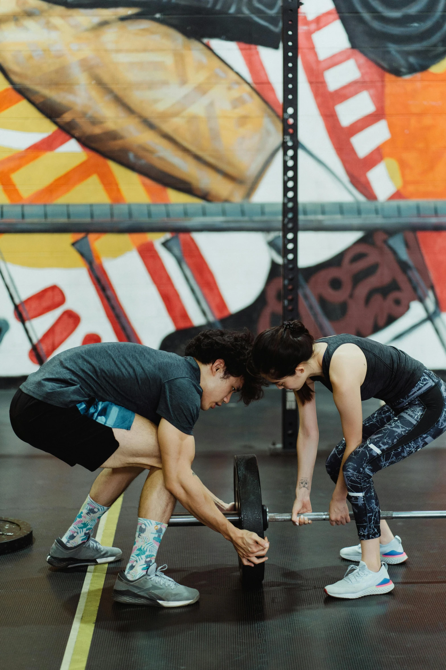 a group of people doing squats in a gym, by Jessie Algie, renaissance, adam ondra, 2 people, gemma chen, “ iron bark