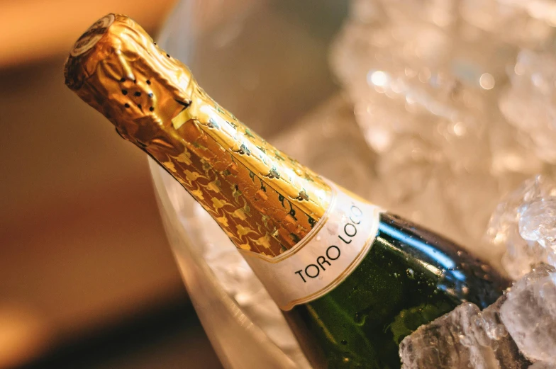 a bottle of champagne sitting on top of ice, inspired by Tomàs Barceló, gojo satoru, profile image, close up image, torri