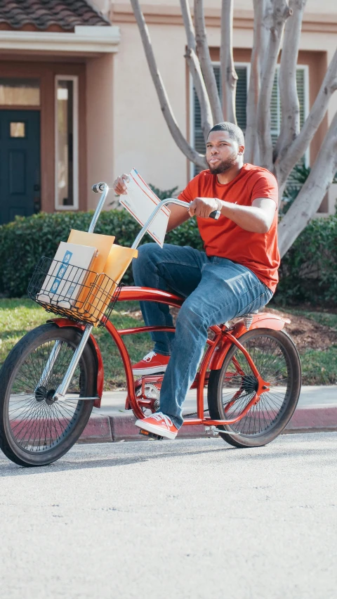 a man riding on the back of a red bike, shaquille o'neil pregnant, getting groceries, student, restomod