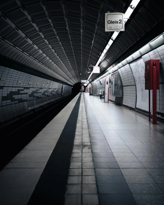 a black and white photo of a subway station, unsplash contest winner, lgbtq, reflective floor, color picture, thumbnail