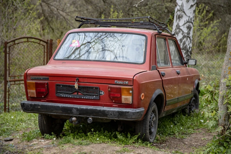 a red pick up truck parked next to a tree, pexels contest winner, renaissance, russian lada car, ((rust)), square, under repairs