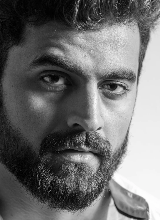 a black and white photo of a man with a beard, by Patrick Pietropoli, portrait of henry cavill, rahul gandhi face, portait photo profile picture, square