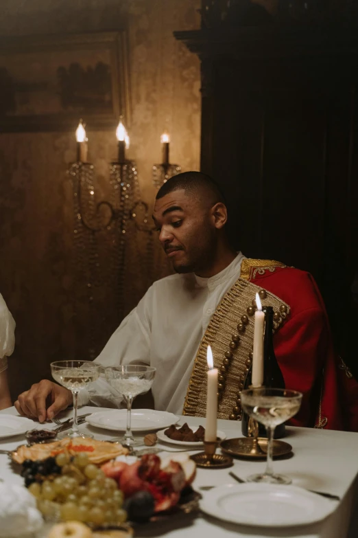 a man and a woman sitting at a dinner table, an album cover, inspired by Edwin Austin Abbey, pexels contest winner, renaissance, cinematic still frame, royal robe, frank ocean, food commercial 4 k