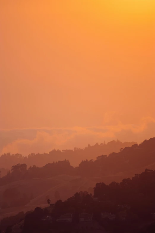 a large jetliner flying over a lush green hillside, by Peter Churcher, tonalism, light orange mist, sf, silhouetted, do
