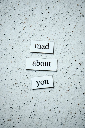 a piece of paper with the words mad about you written on it, by Maud Naftel, magnetic, concrete poetry, thumbnail, sad scene