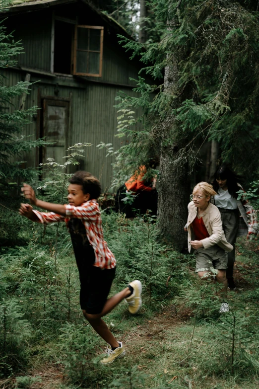 a group of people playing frisbee in the woods, by Jaakko Mattila, hurufiyya, award winning movie still, children's, cabin, 2 0 0 0 s