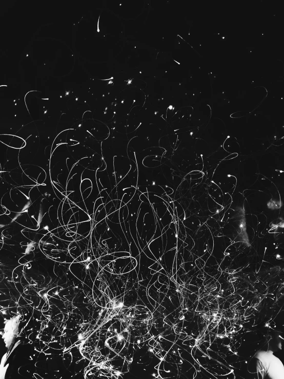 a black and white photo of a group of people, a microscopic photo, by Adam Marczyński, unsplash, lyrical abstraction, glowing wires everywhere, many tentacles, scattered light, listening to music at 2 am