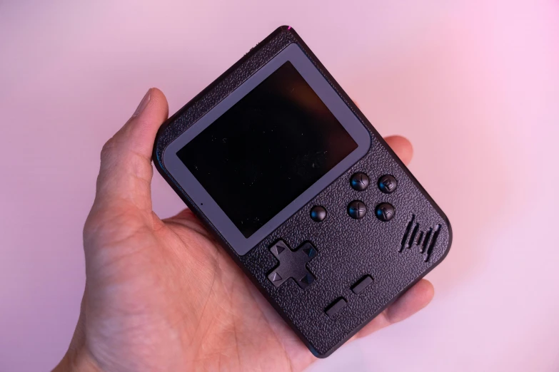 a person holding a game boy in their hand, black textured, smooth tiny details, 🔥 😎 🕹️ 👀 :2, built on a small