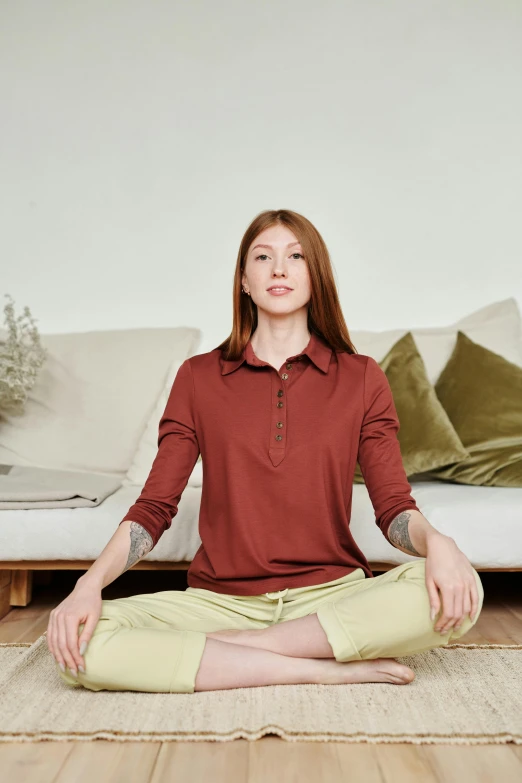 a woman sitting in a lotus position on a rug, inspired by Li Di, trending on pexels, renaissance, wearing polo shirt, hammershøi, terracotta, product introduction photo