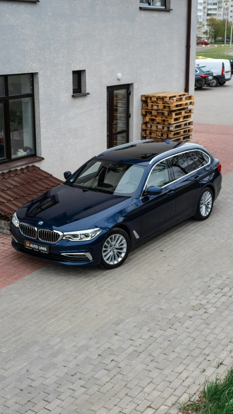 a black bmw with some wood on it