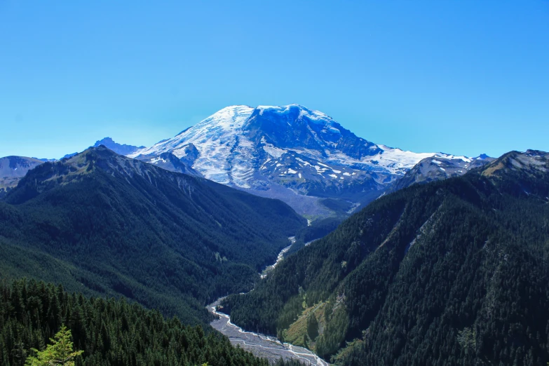 a very big mountain sitting above a river