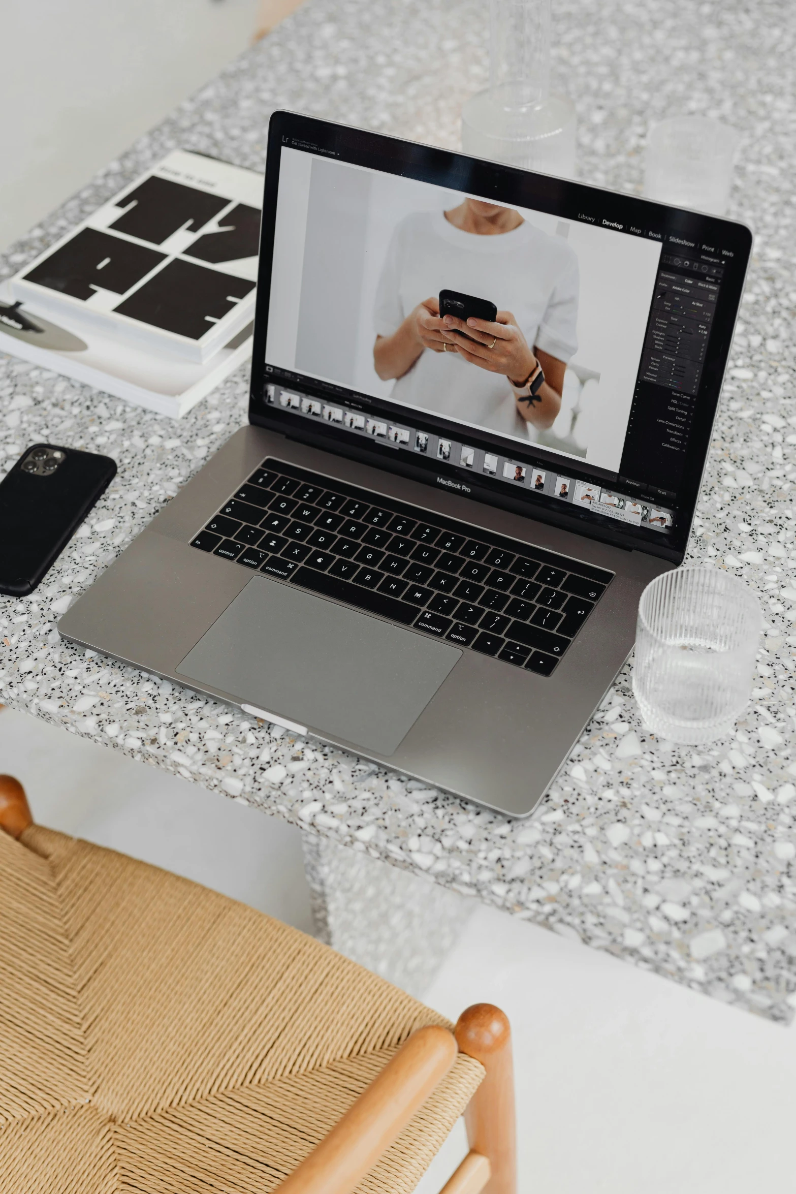 a laptop computer sitting on top of a wooden chair, a computer rendering, trending on pexels, marble countertops, glittery, model posing, grey