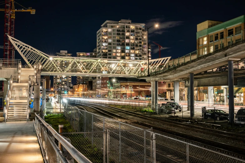 a train tracks and a night sky view