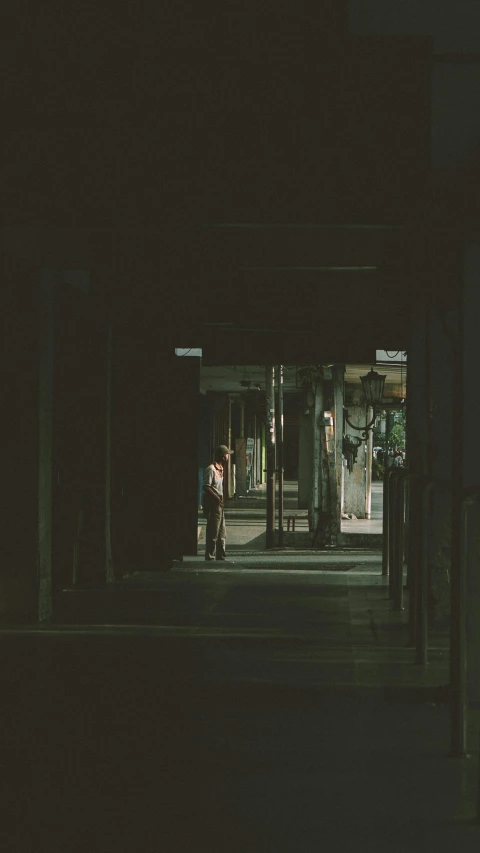 a couple of people that are standing in the dark, inspired by Elsa Bleda, conceptual art, abandoned shopping mall, green alley, vintage color photo, instagram photo