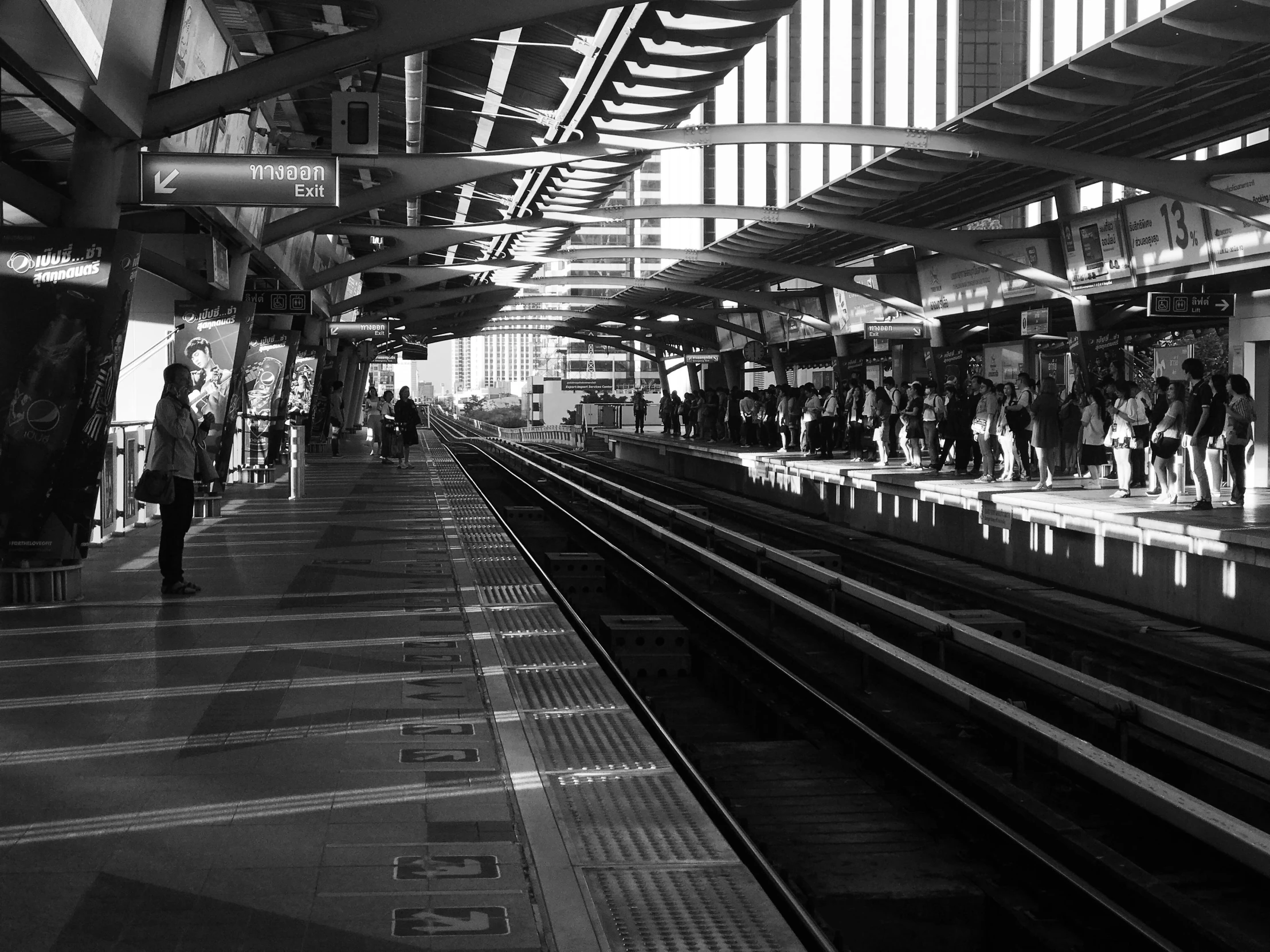 a black and white photo of a train station, bangkok, 'action lines '!!!, 2 0 1 0 photo