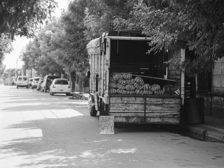 a black and white po of a truck that has been loaded