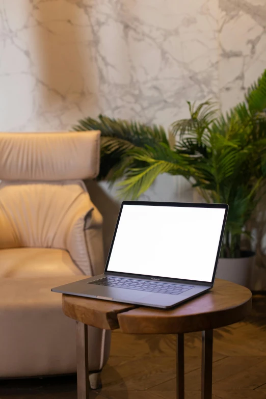 a laptop is sitting on a small table