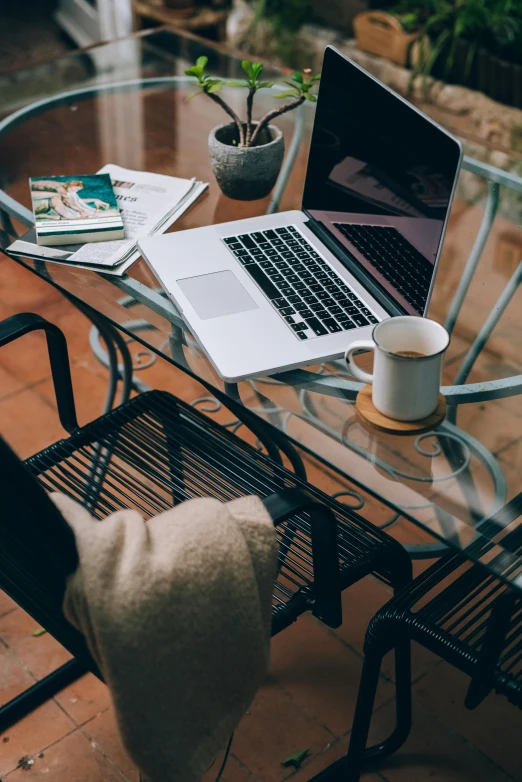 a laptop computer sitting on top of a glass table, morning coffee, curated collections, student, brown