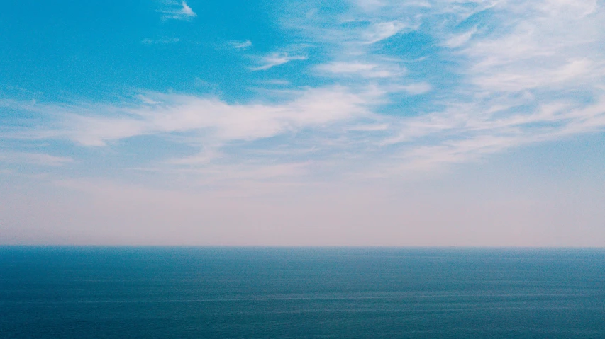 a view of the ocean from the top of a hill, pexels contest winner, minimalism, sky blue, gradient, floating into the sky, muted color (blues