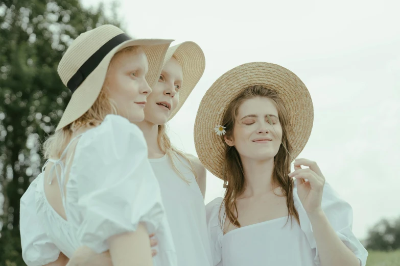 a couple of women standing next to each other, pexels contest winner, renaissance, white straw flat brimmed hat, 3 young and beautiful women, cottagecore, pale light