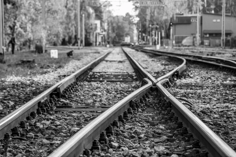 a black and white photo of a train track, a black and white photo, from wheaton illinois, square lines, idyllic, worlds collide