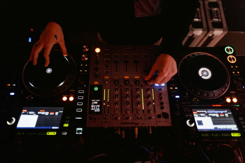 a dj mixing music in a dark room, pexels, avatar image, birdseye view, gif, brown