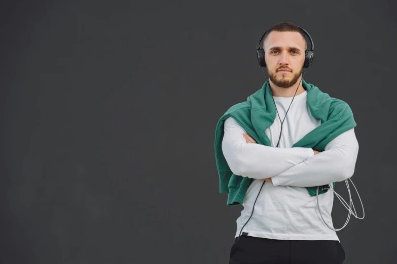 a man wearing headphones and looking away