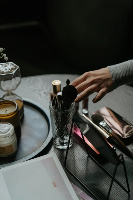 a person's hand reaching for an item on a tray