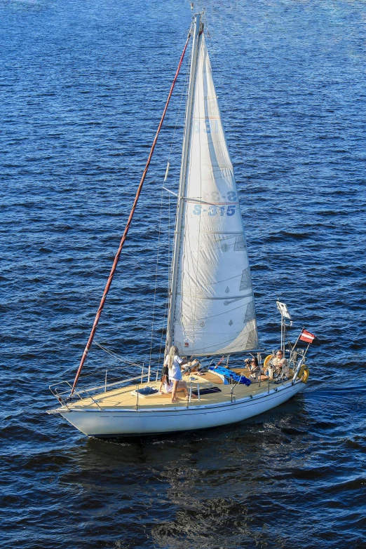 a sailboat in the middle of a large body of water, espoo, profile image, a high angle shot, 3 6 years old