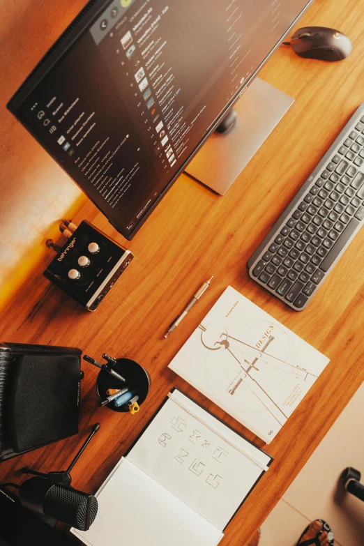 a desktop computer sitting on top of a wooden desk, pexels contest winner, analytical art, 9 9 designs, drone photograph, architect, shot on sony a 7