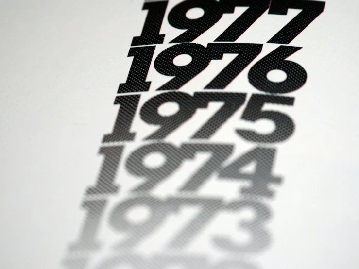 a close up of a sheet of paper with numbers on it, a screenprint, inspired by Zsolt Bodoni, international typographic style, 70s photo, evolution, new adidas logo design, 1759