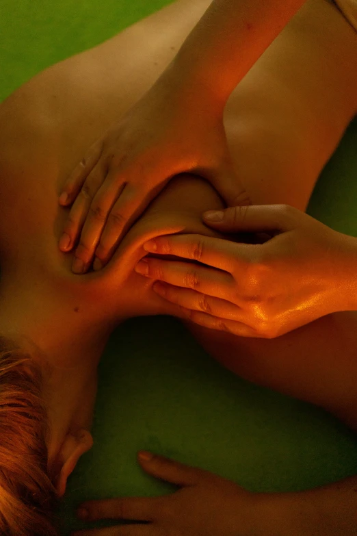 a woman getting a back massage at a spa, by Julian Allen, dramatic green lighting, square, hands, null