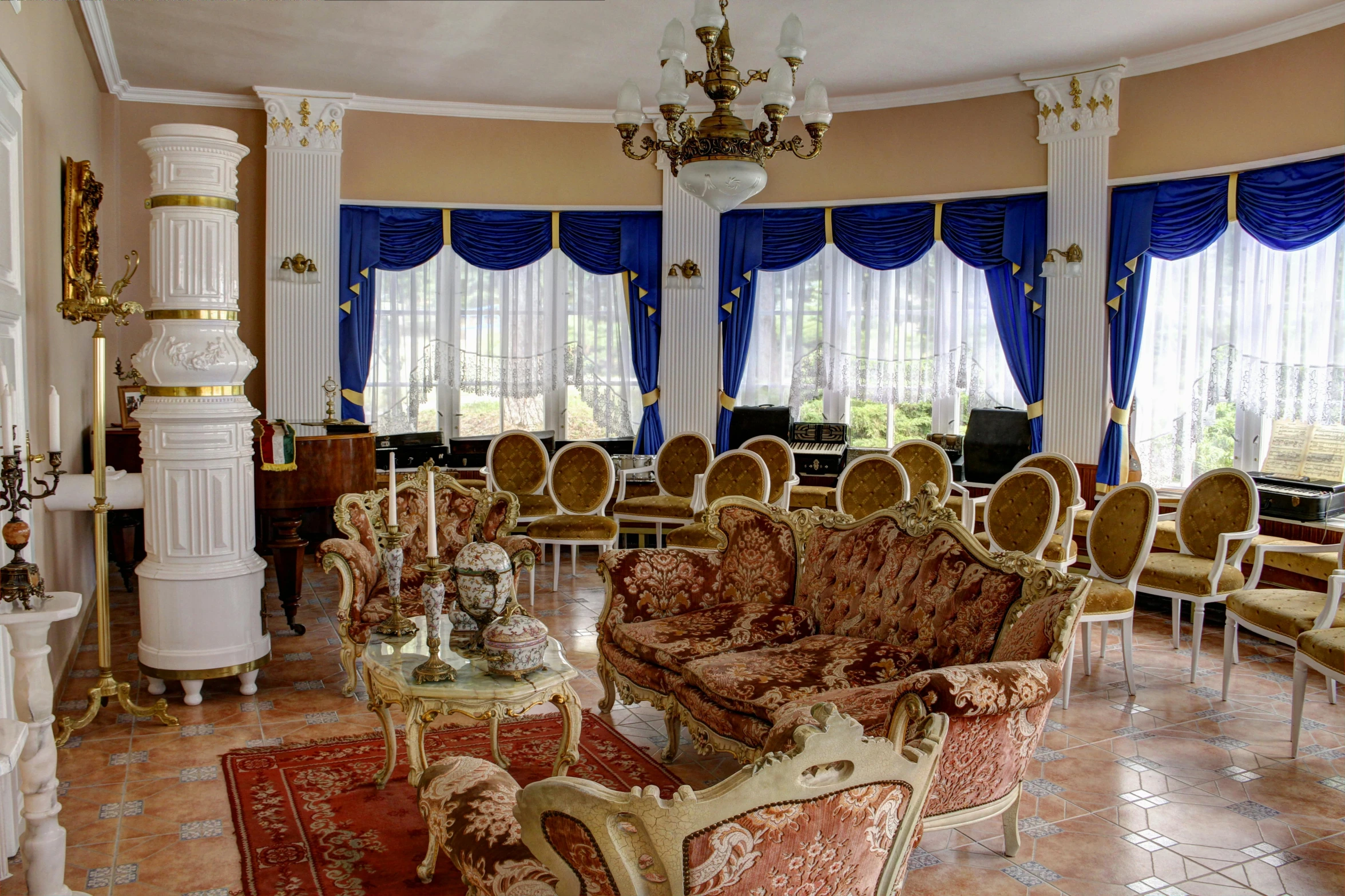 a living room with an elegant, elaborate ceiling