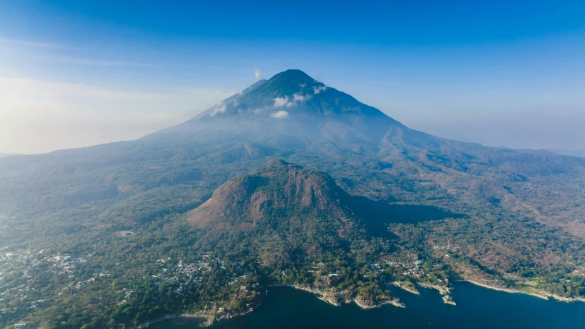 a view of a mountain that has a lot of trees on it