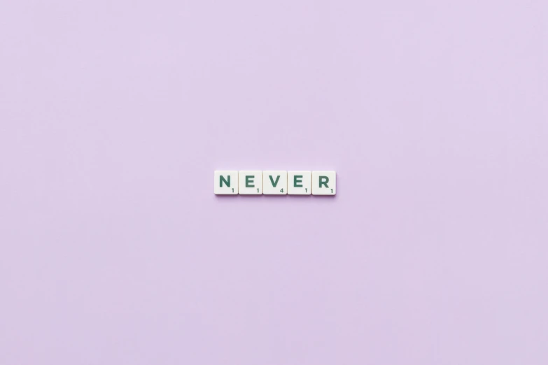 the word never spelled in scrabbles on a purple background, a picture, by Caro Niederer, trending on pexels, pixel art, on a pale background, minimalist photo, taken with canon 5d mk4, van lieven