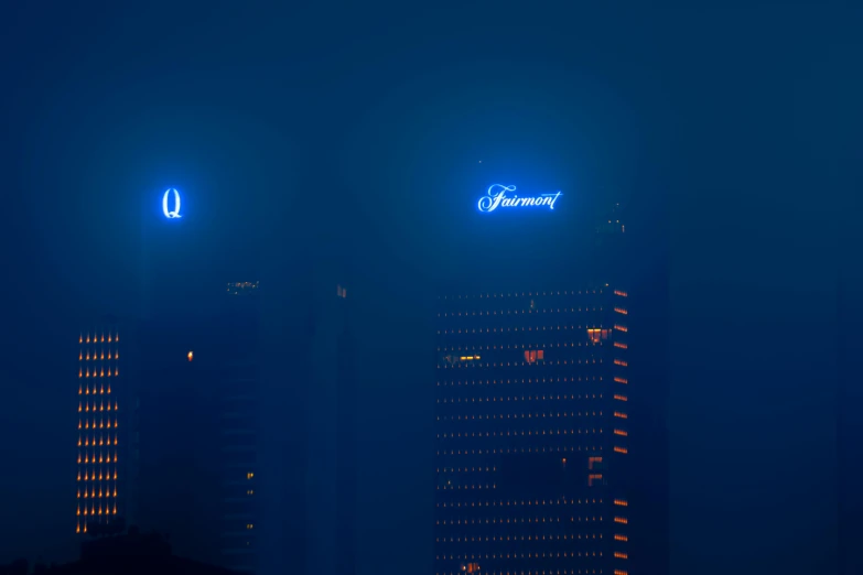 a couple of tall buildings sitting next to each other, by Joseph Severn, pexels contest winner, neon fog, blue leds, header with logo, telephoto shot