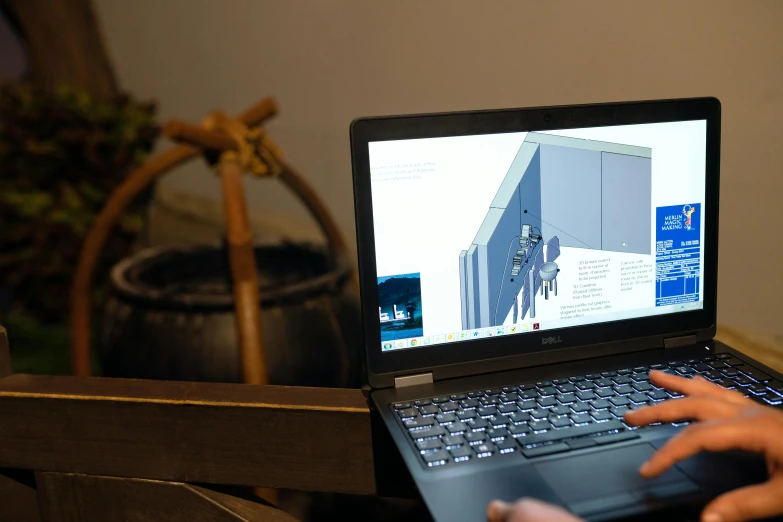 a person using a laptop computer on a table, a computer rendering, autodesk, promo image, pc screen image, indoor shot