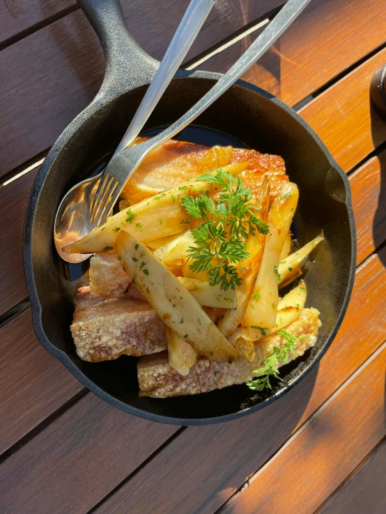 a bowl of food sitting on top of a wooden table, inspired by Pia Fries, renaissance, butterflyfish, with fries, on a sunny day, thumbnail