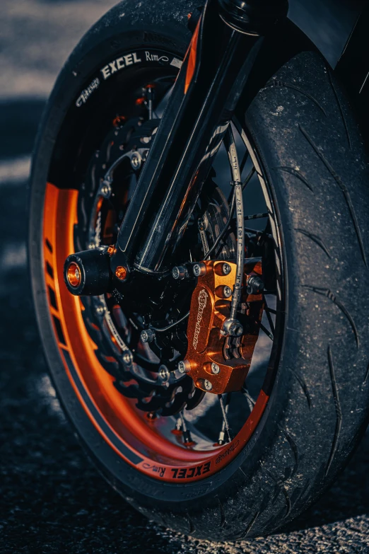 a close up of the front wheel of a motorcycle, a digital rendering, pexels contest winner, orange metal ears, full body close-up shot, multi-part, dramatic product shot