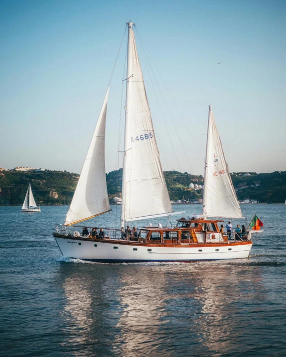 a sailboat sailing on a large body of water, full of people, rosalia vila i tobella, large open windows