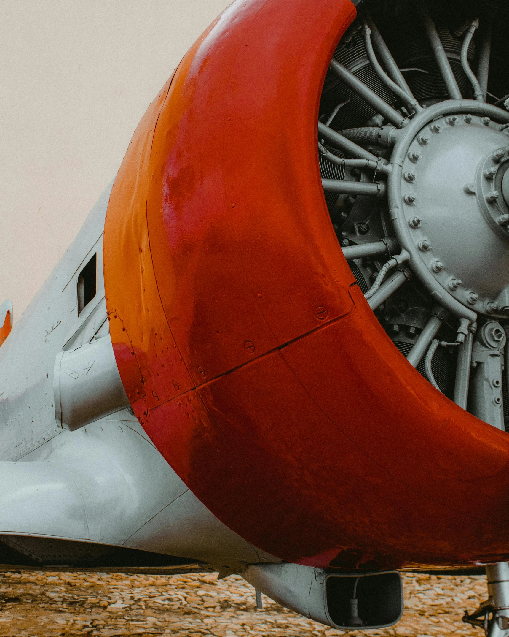 a close up of a propeller on a plane, a colorized photo, by Carey Morris, pexels contest winner, white and orange breastplate, big engine, crimson themed, museum photo