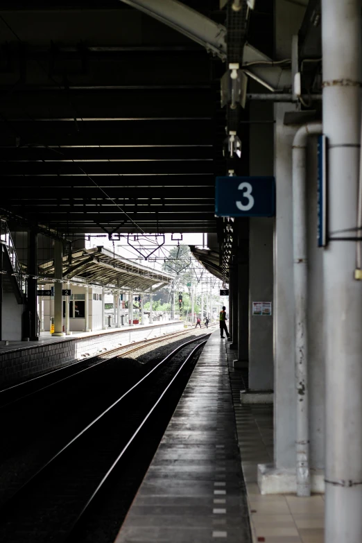 a train station with a train on the tracks, by Sengai, flickr, bangkok, facing away from camera, square, no text