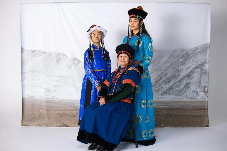 three women in traditional clothing posing for a picture, an album cover, inspired by Guo Xi, unsplash, arctic, portrait n - 9, full body 8k, portrait of family of three