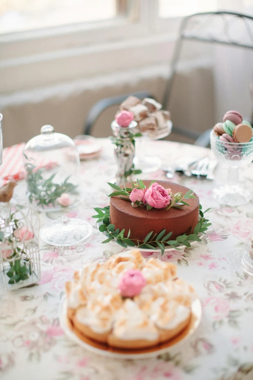 a table that has a bunch of cakes on it, unsplash, rococo, rose garden, high resolution photo, delicate details, brown